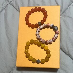Set of Three Beaded Bracelets in Red, Yellow, and Multicolor